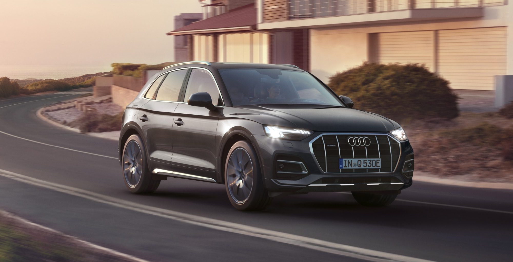 Black Audi Q5 driving in a residential seting