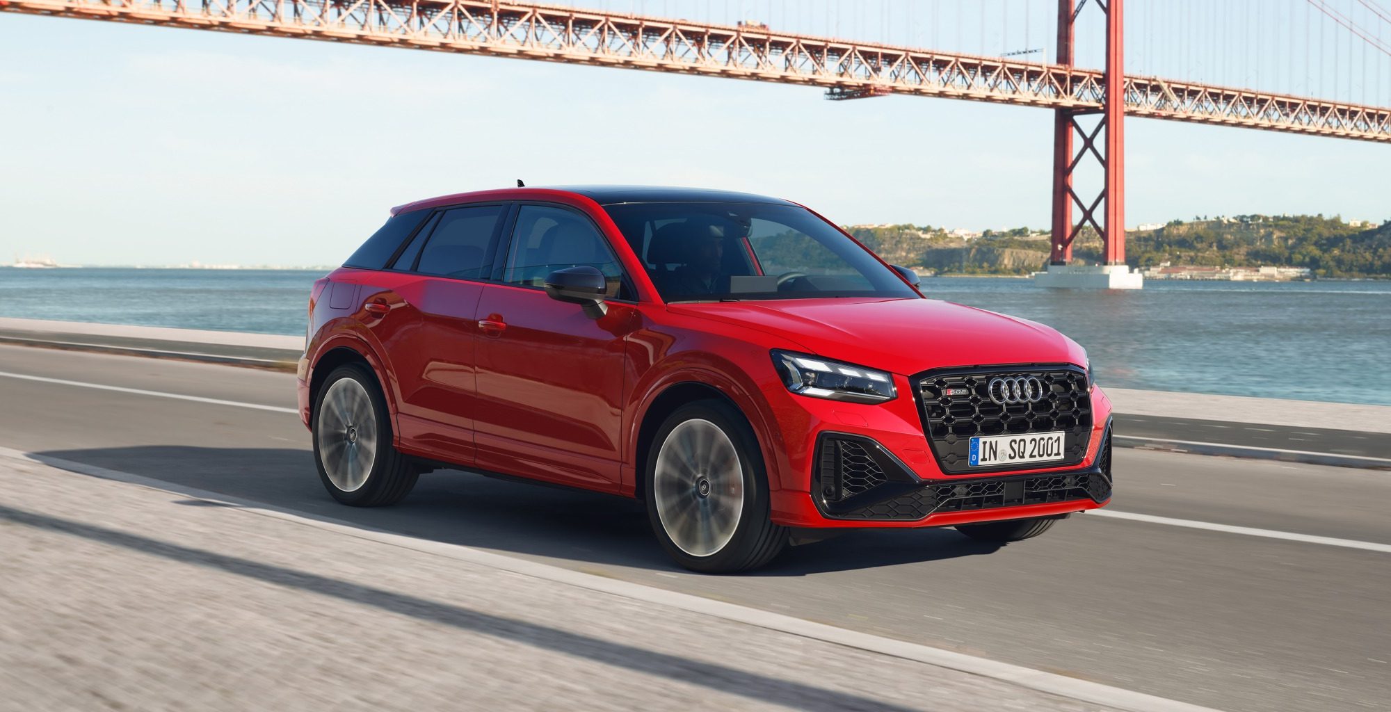 Red Audi SQ2 with a water background