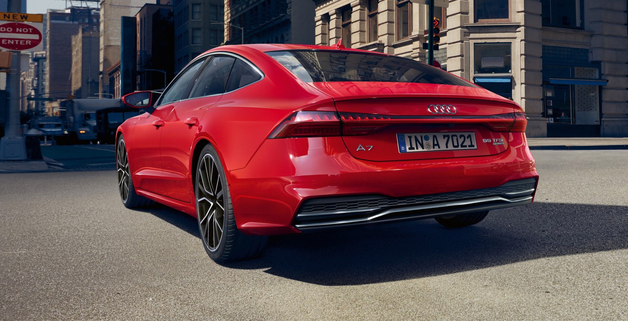 The back of a red Audi A7 Sportback in a urban setting